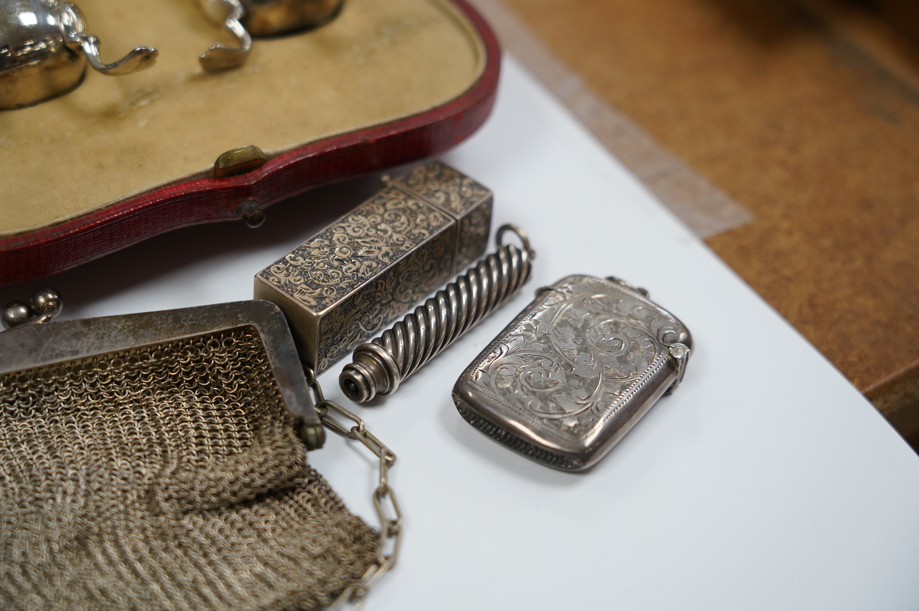 Sundry small silver including two cased condiment sets, a card case, vesta, scent flask, etc. and a plated evening bag. Condition - poor to fair